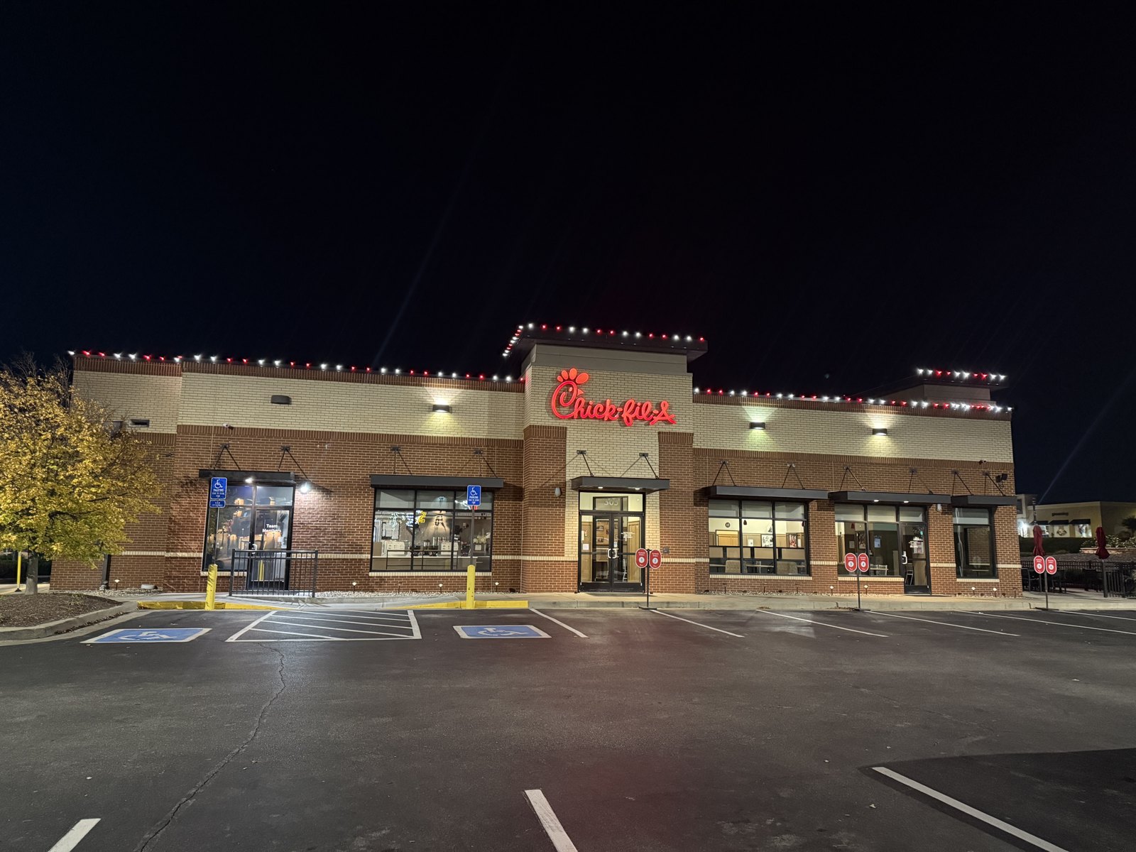 Chick-fil-A entrance and roofline decorated for Christmas